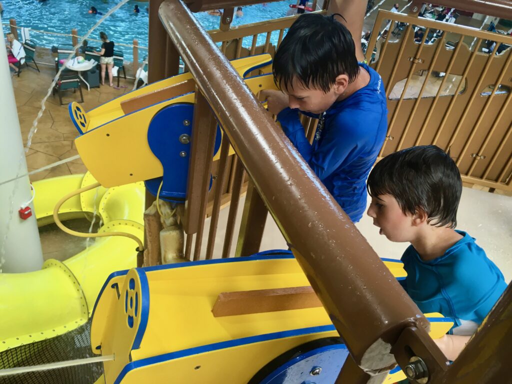 boys aiming water gun