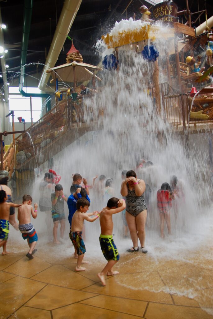 crowd getting doused with water