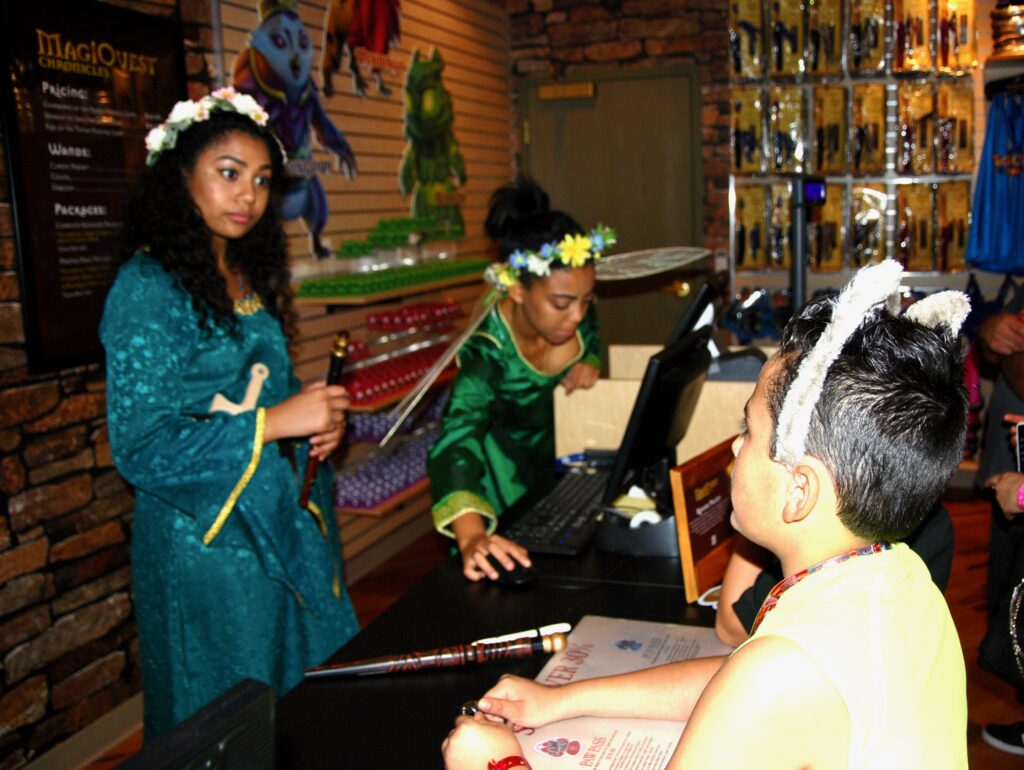boy at magicquest counter