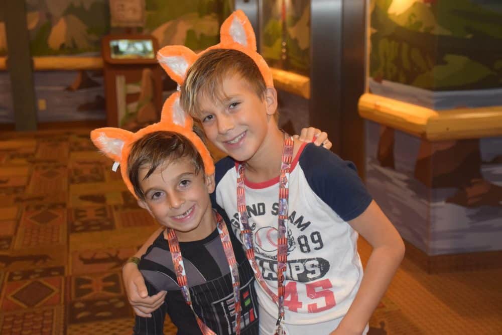 boys hugging in orange wolf ears - Great Wolf Lodge Spooktacular