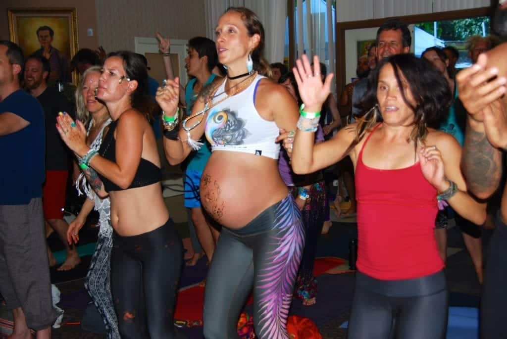 people during a yoga class - Finding Your Alternate Universe at Shakti Fest