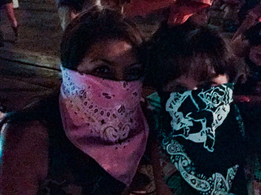 women with bandanas covering faces - Stagecoach Music Festival Tips