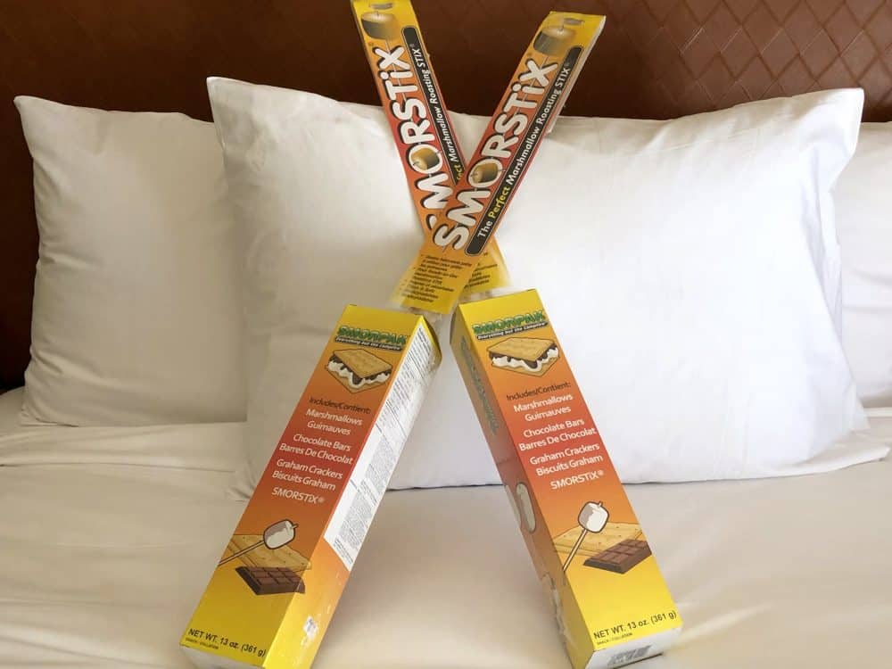 Two s'more kits propped against a pillow - Hyatt Regency Westlake staycation