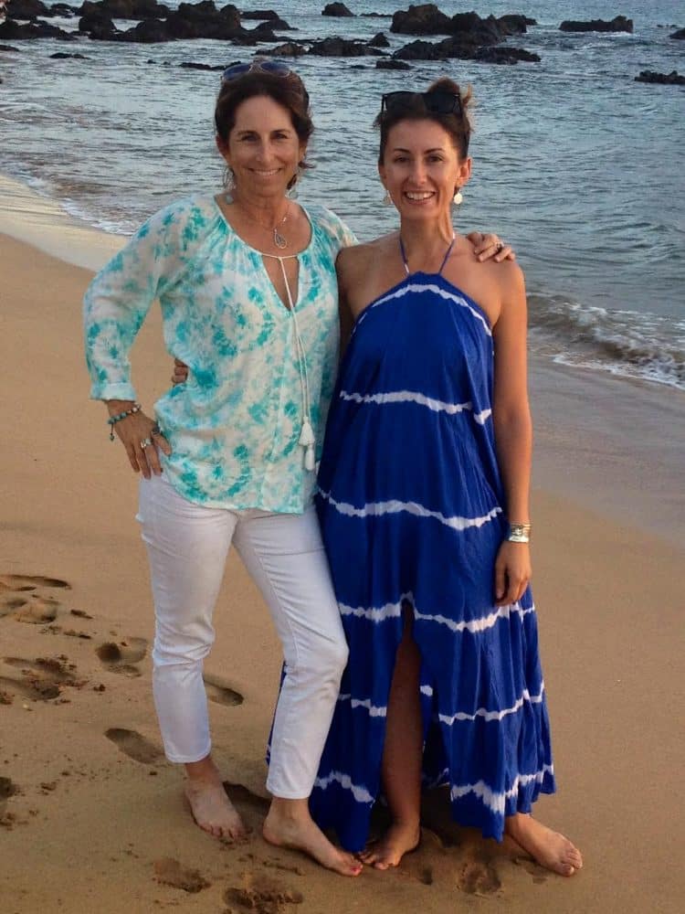 2 women at the beach - 7 Tips for Traveling with Girlfriends