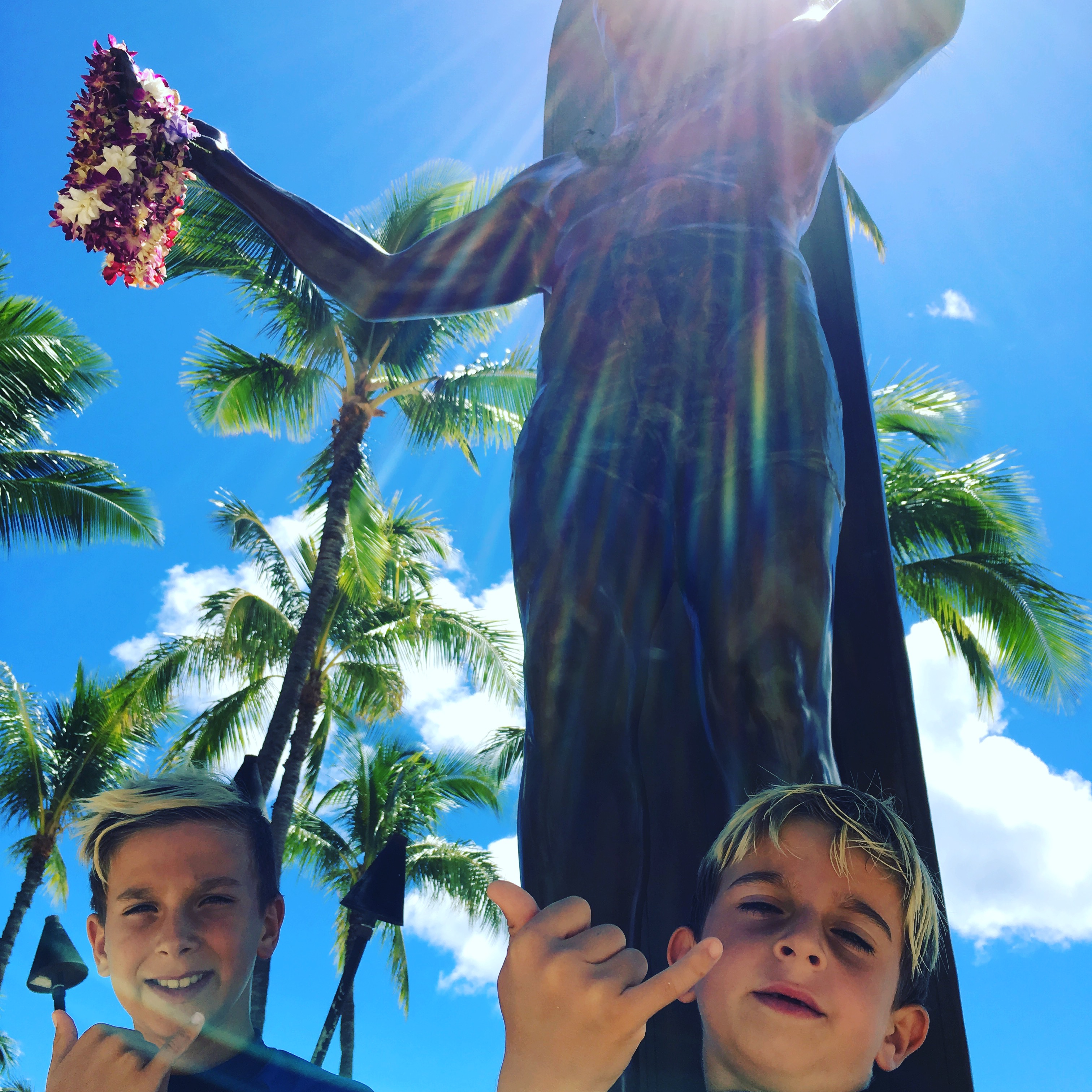 bronze statue of legendary surfer and Olympic Gold medal swimmer, Duke Kahanamoku on Kuhio Beach.