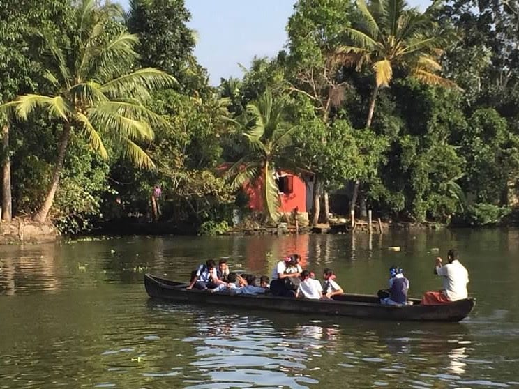 people on a canoe - A Magical Family Adventure in India