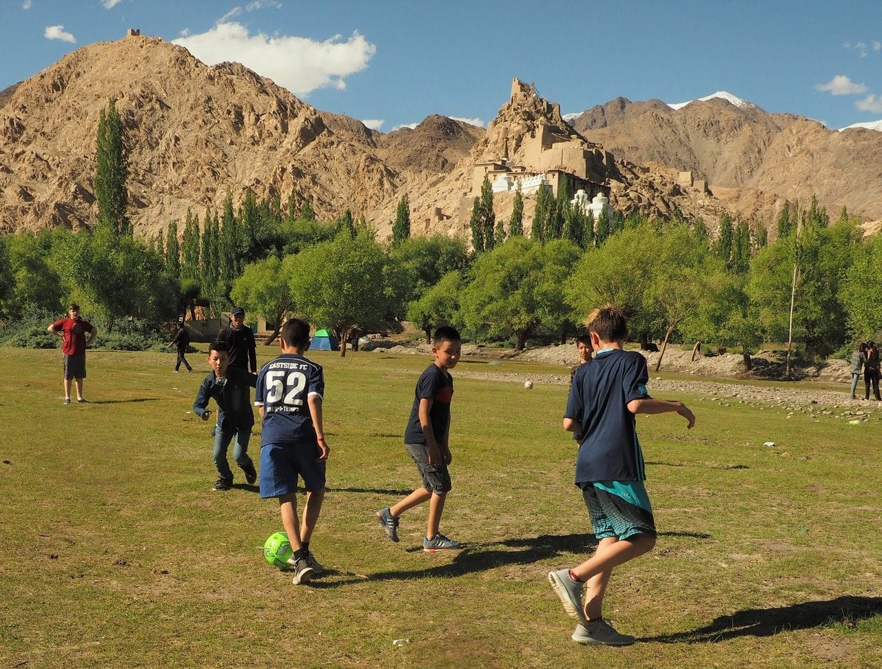Kids Playing soccer in Ladakh - volunteer family travel to India - A Magical Family Adventure in India