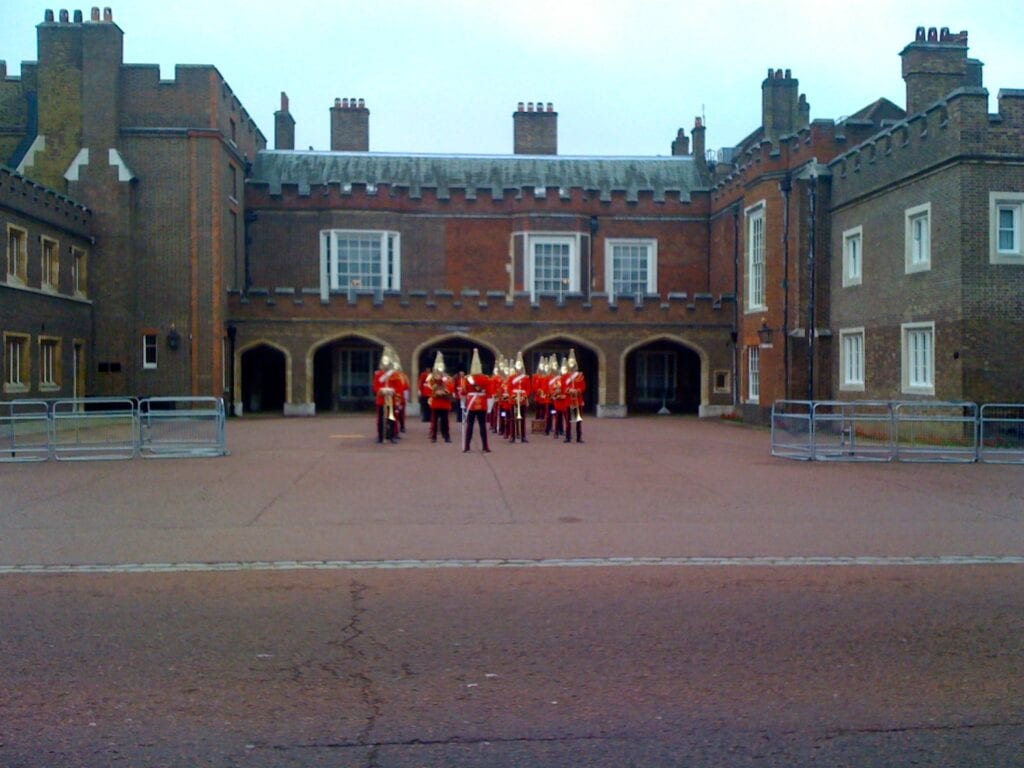 London guards out front of building - Hop On - Hop Off Bus Tours: An Affordable Way to Travel with Kids