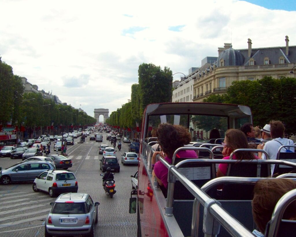 Hop-on, Hop-off bus in the Champs-Élysées - Photo by Samantha Davis-Friedman - Hop On - Hop Off Bus Tours: An Affordable Way to Travel with Kids