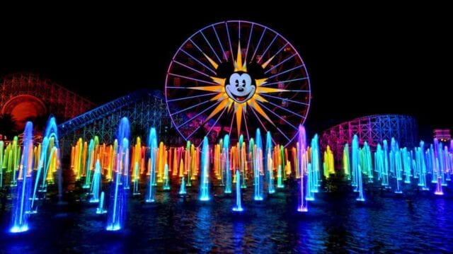 Disneyland Ferris Wheel lit up at night - Disneyland family vacation packages Adventures by Disney