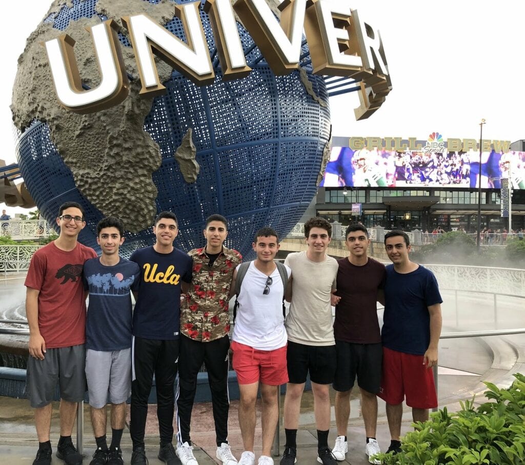 Teens at Universal Family posed out front of Studios Orlando - Attraction Review: Hagrid’s Magical Creatures Motorbike Adventure