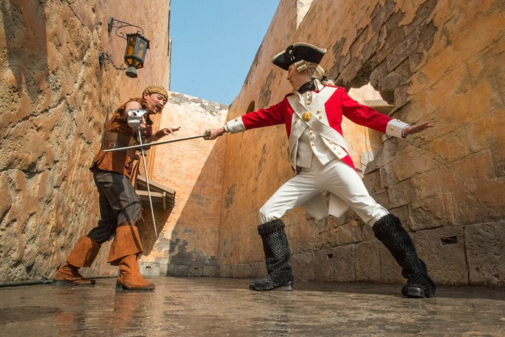 2 men sword fighting - Behind the Scenes at Disney: An Invitation to Explore