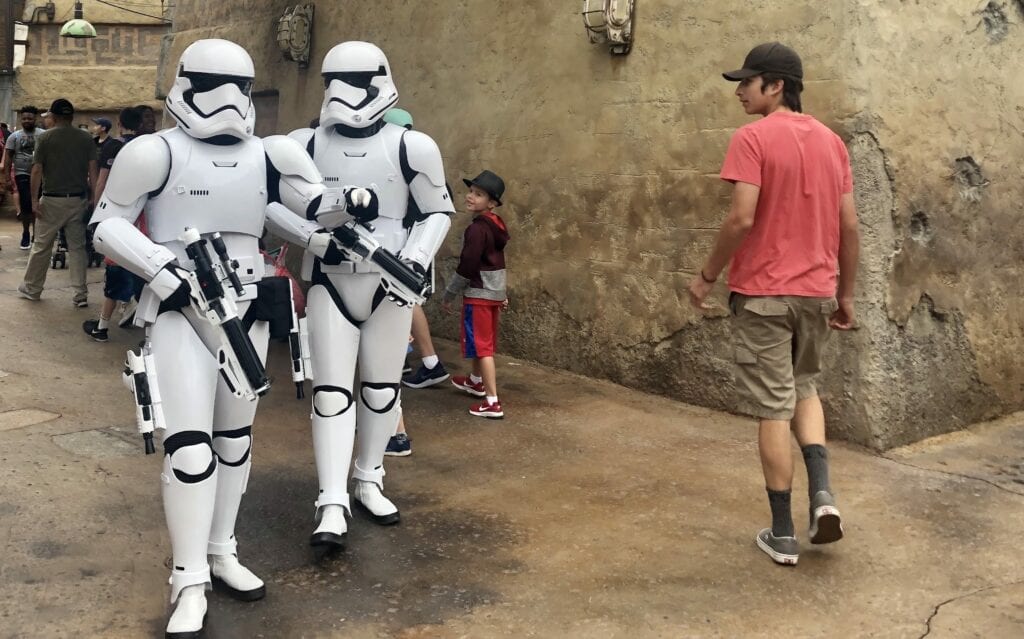 man walking by Stormtrooper - Behind the Scenes at Disney: An Invitation to Explore