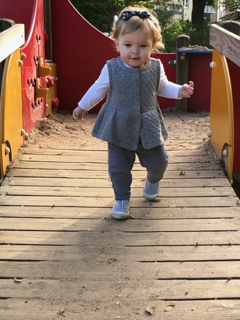 Baby playing on playground - How to Survive a Vacation in Europe with a Baby