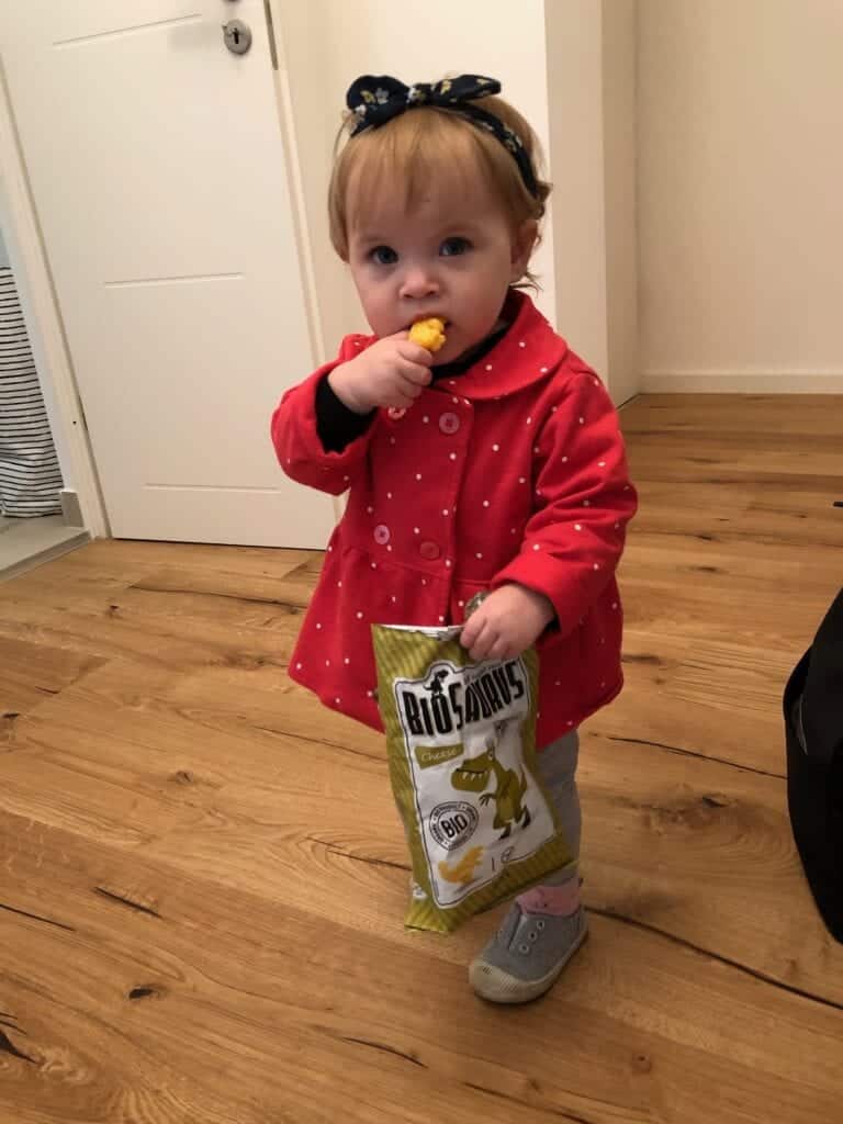 Baby eating snacks - How to Survive a Vacation in Europe with a Baby