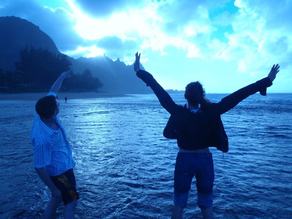 People standing in the water at the beach - Escape to Kauai With Family