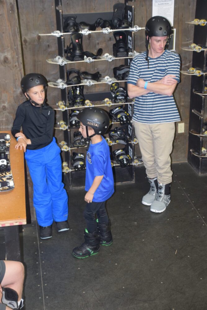 Boys waiting to get gear at Woodward Copper - things to do in vail with kids