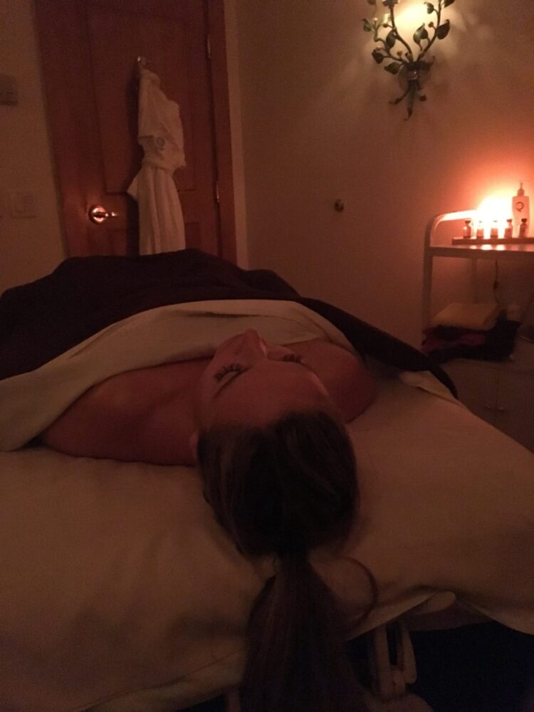 woman lying on massage bed in Sonnenalp Spa - things to do in vail with kids