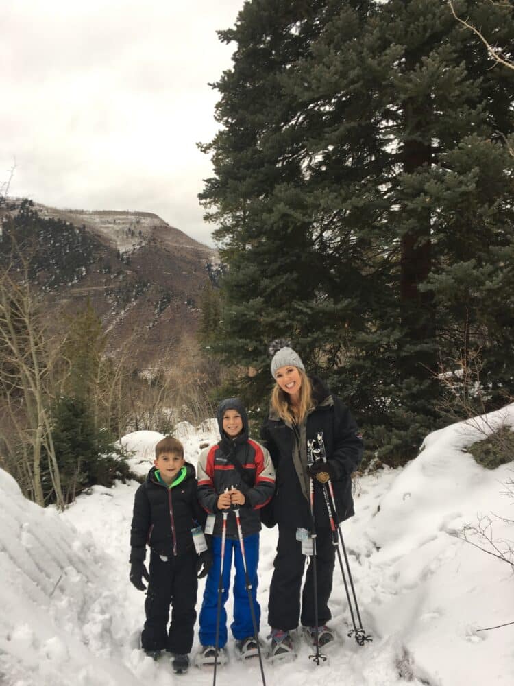 Mom with boys on snowshoes around trees - things to do in vail with kids - Sonnenalp Hotel in Vail, Colorado