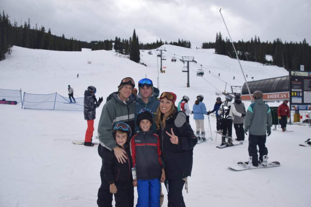 Family of five posing at the ski slopes - Fun Things to do with kids in Vail, colorado