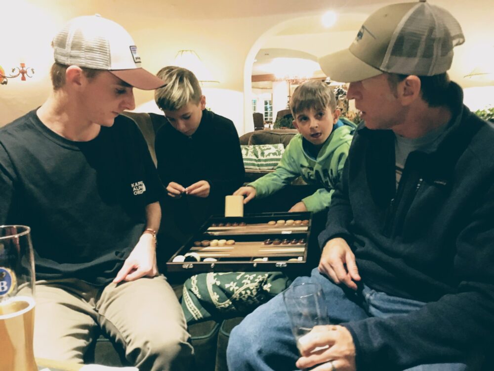 Father and teen playing backgammon - things to do in vail with kids - Sonnenalp Hotel in Vail, Colorado