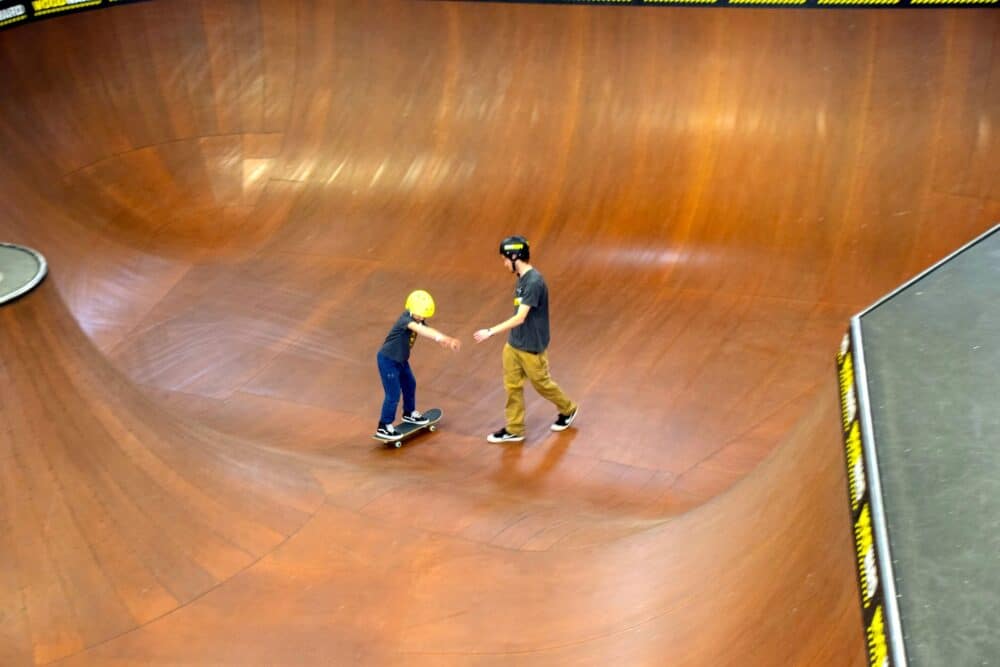 boy on skateboard in pool like course