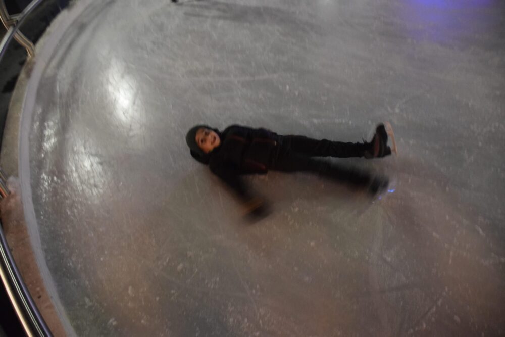 Boy laying on ice - Fun with Kids in Vail Colorado