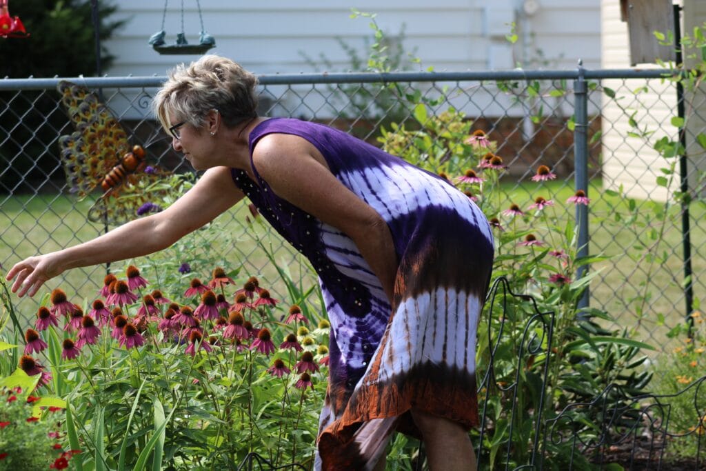 Women tending to her plants - Travel In Time: Tips to Help the Elderly Cope with Coronavirus
