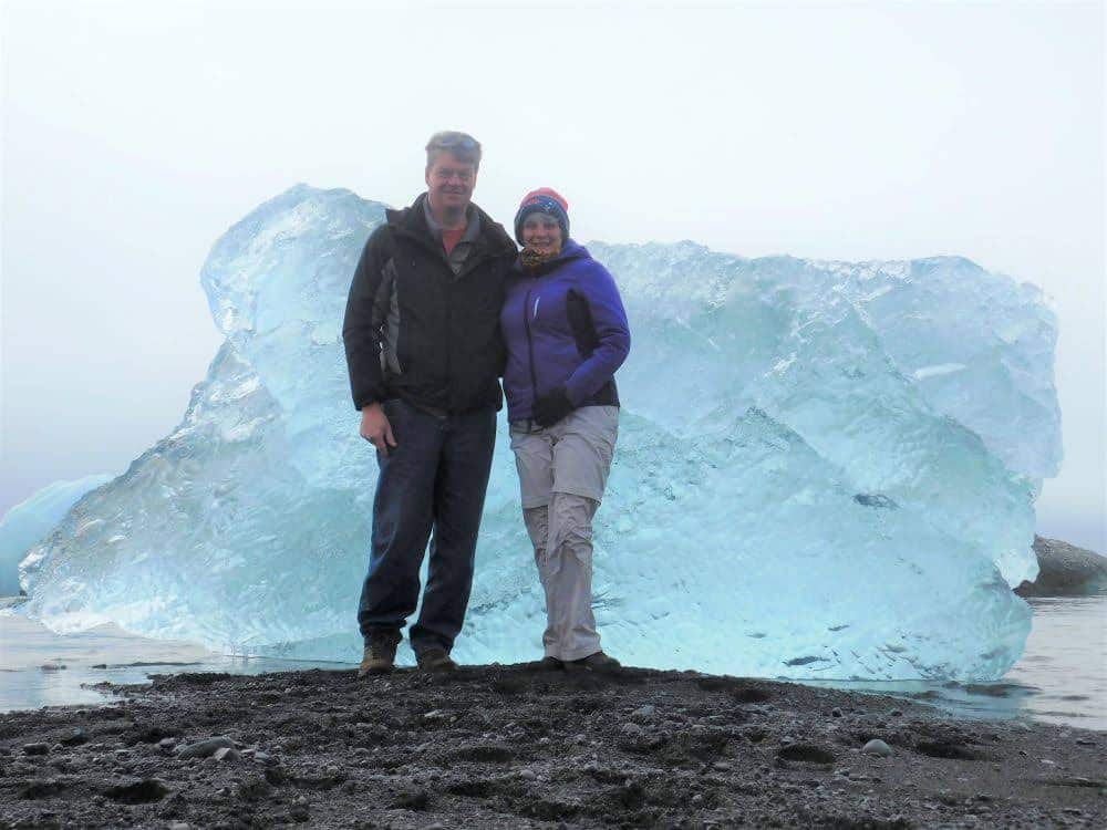 couple in front of many large icebergs - (Family) Travel In the Time of Corona