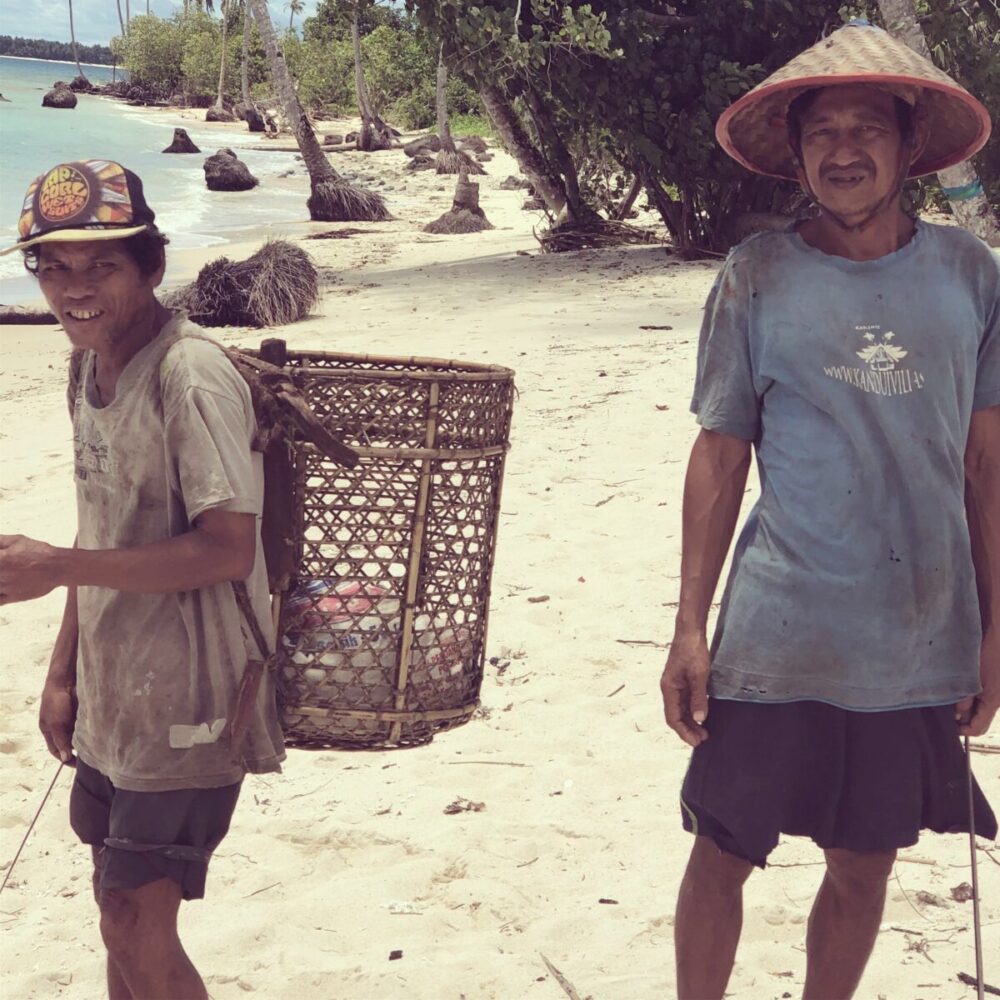 Locals foraging for coconuts around Mentawai Surf Resort - Surfing Indonesia - The Best Family Surf Trip