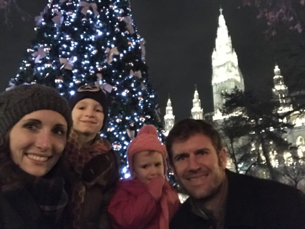 Family photo in front of christmas tree - The Trick That Saved Our Family Trip Through Austria