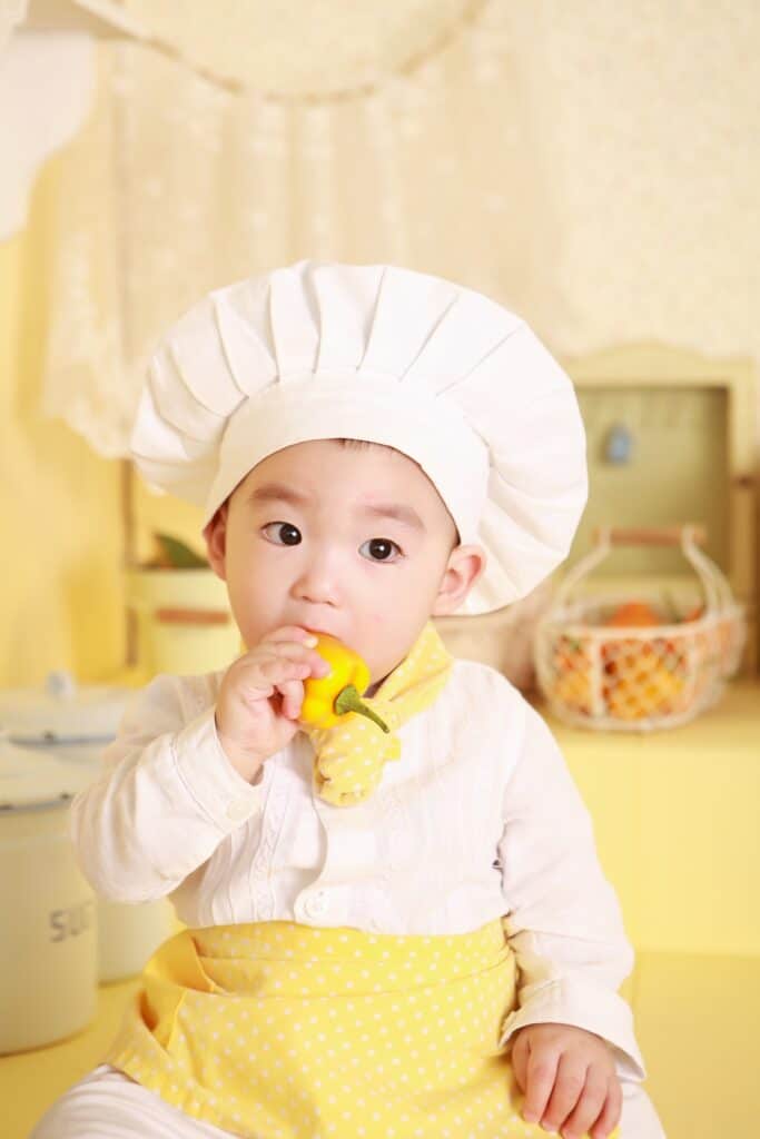 5 Kid dressed up as a chef - Fun Staycation Ideas to Get Your Kids Excited About Being Home