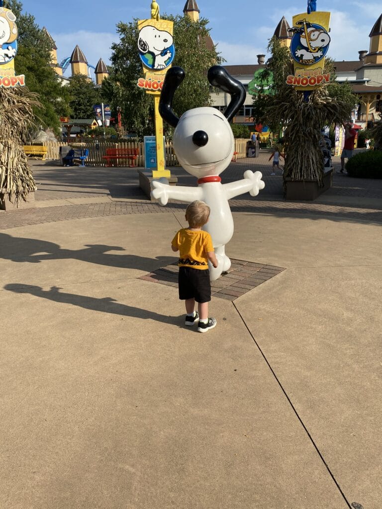 Photo of toddler with a snoopy statue - 6 Tips to Survive your First Hotel Stay with a Baby