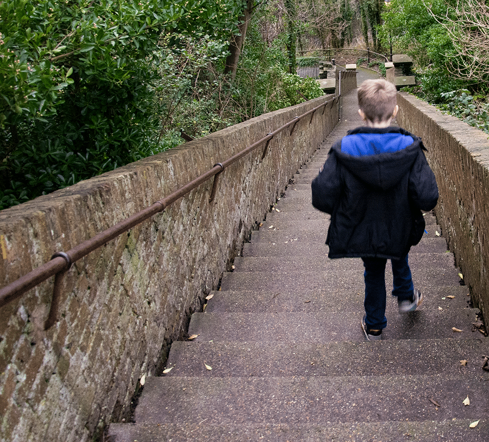 Child walking down Dover Castle steps - Dover: A Day Trip from London