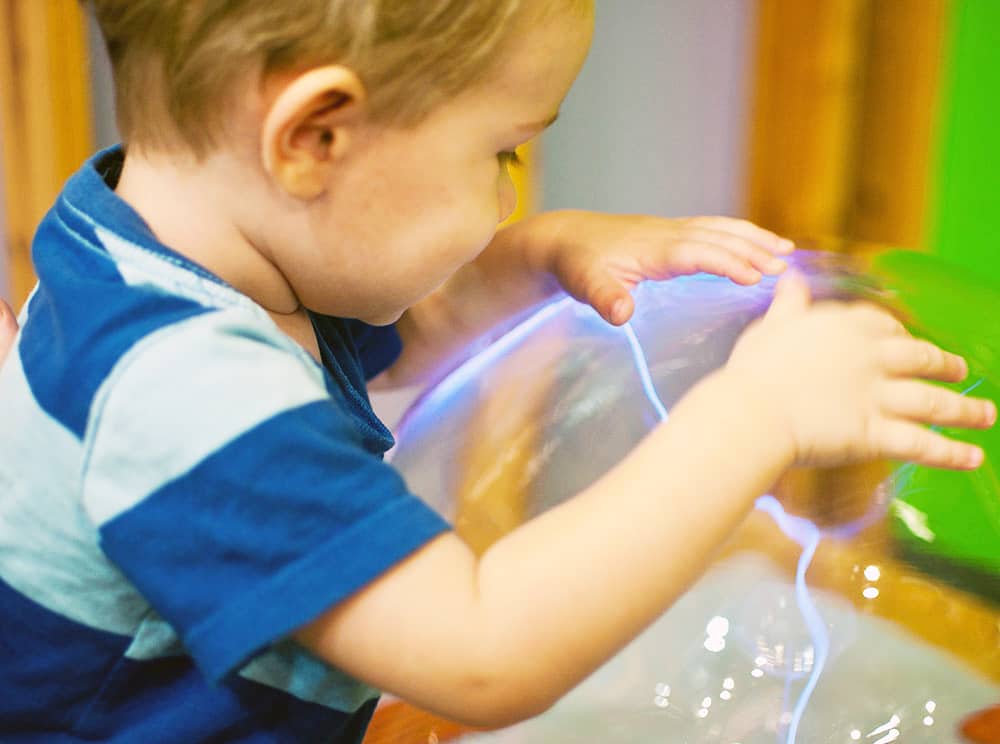 little kid with clear ball - things to do with kids in chattanooga