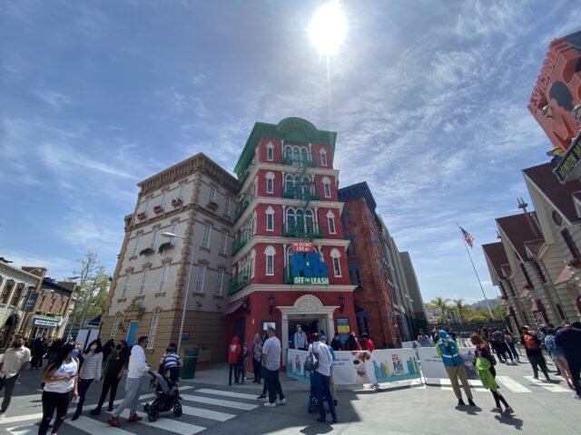 Riders enter 'Secret Life of Pets - Off The Leash!" through Katie’s New York City apartment building from the movies