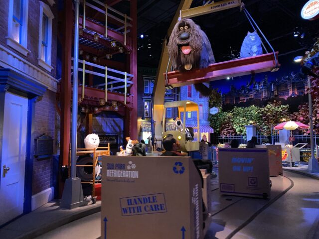 Riders board cardboard box-shaped vehicles in the apartment building's mailroom - 