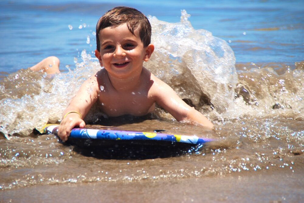 camping with kids at el capitan - boogie boarding