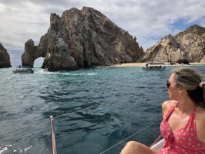 girl looking at el arco - things to do in Cabo San Lucas