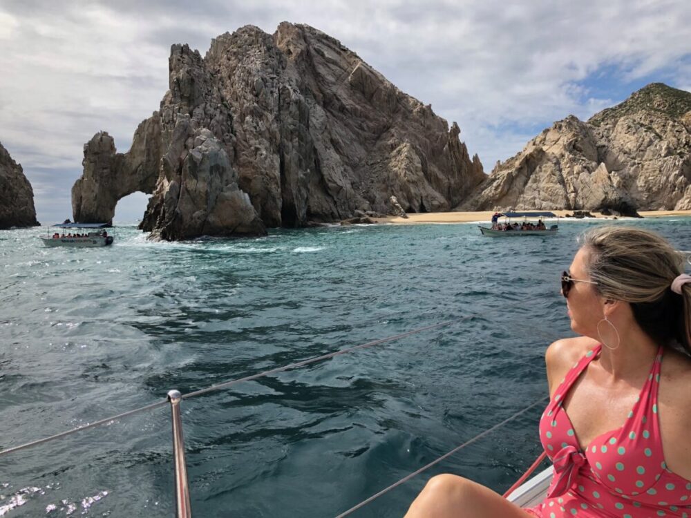 girl looking at el arco - things to do in Cabo San Lucas