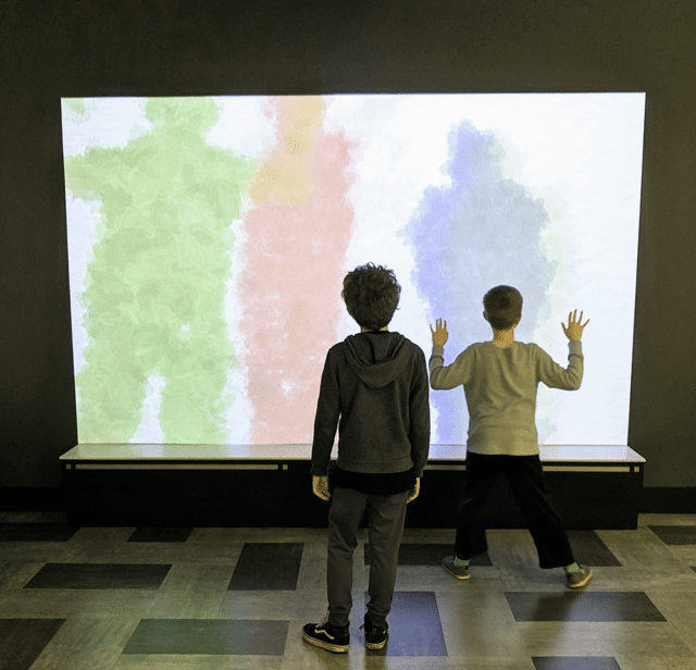 standing at a shadow screen - Best museums in Nashville for Kids