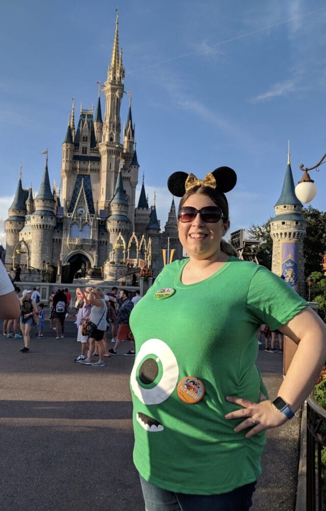 magic castle in background - proud pregnant mama to be in front - Helpful hints and tricks to help you enjoy your babymoon and any other travels while you've got a bun in the oven!