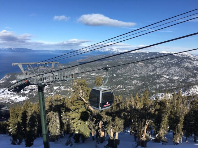 Image of the a gondola moving upwards, with pine trees and Lake Tahoe in the Background.7 Not To Miss Things To Do In South Lake Tahoe With Kids family travel