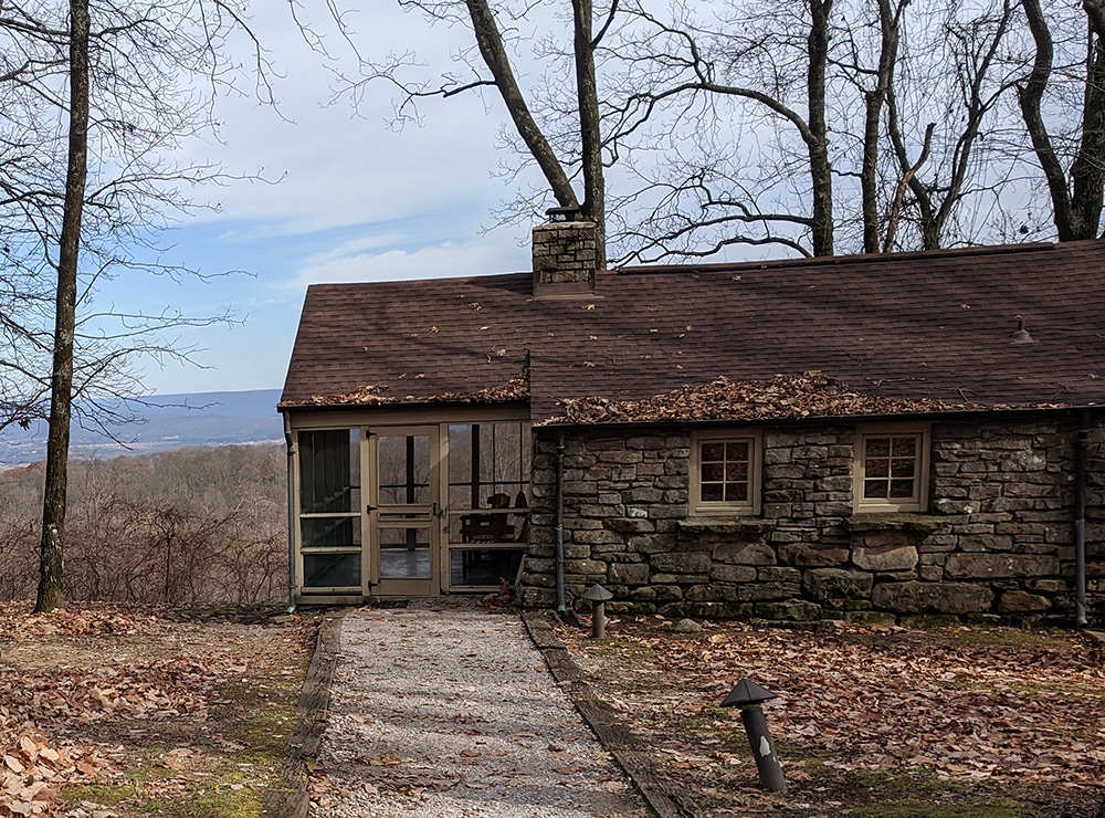 A stone cabin on a mountainside. Retreat to a cabin vacation weekendfor relaxing Labor Day fun. 