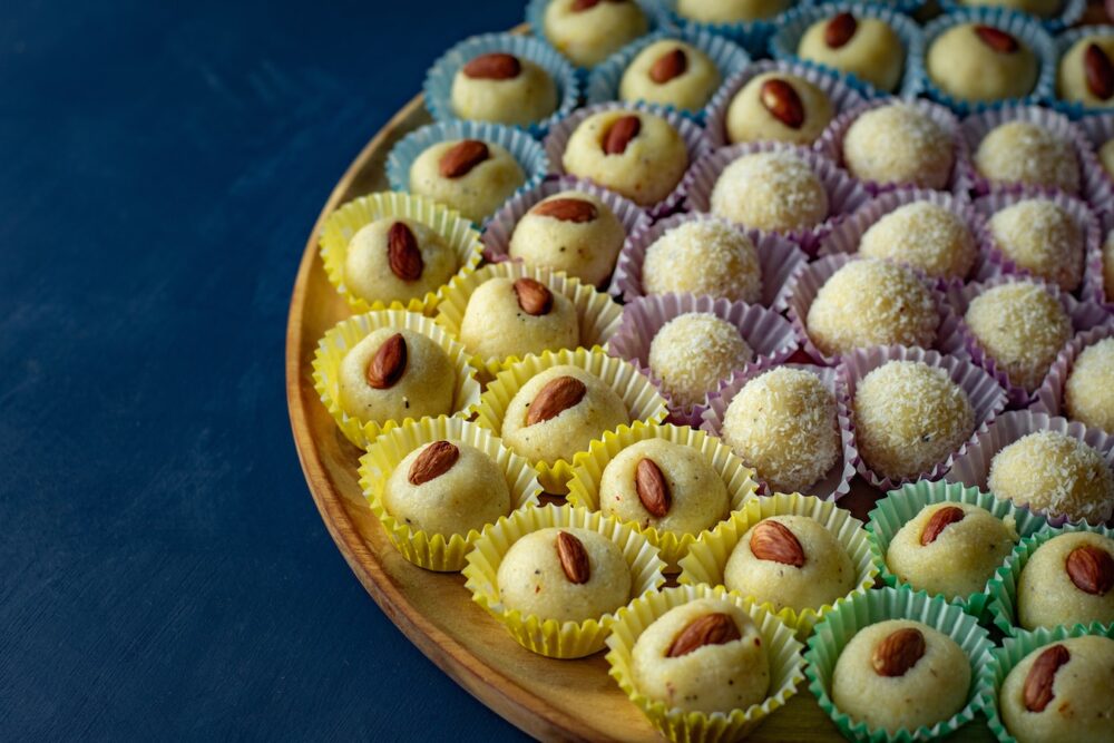a plate of Indian sweets in assorted cups. Diwali: Enjoying the Festival of Lights With Kids family travel