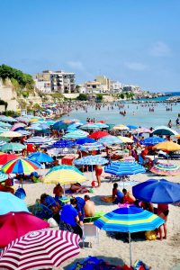 Families enjoying one of Salento's sunny beaches.