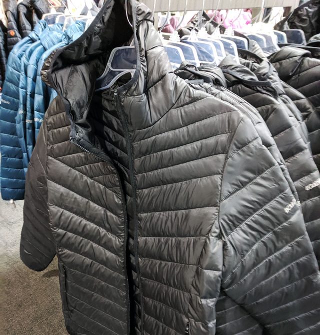 Racks of coats in a store. A warm winter coat is essential gear for cold weather. 