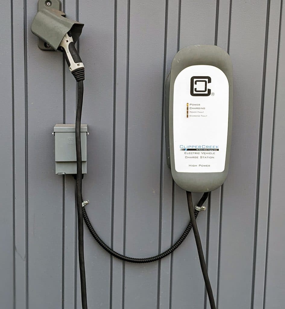 A level 2 EV charger. Tips for Taking a Family Road Trip with an Electric Vehicle