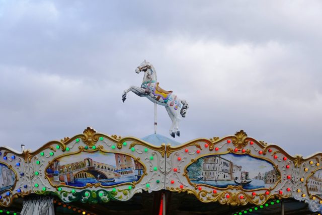 A classic carousel ride complete with stunning hand painted horses 