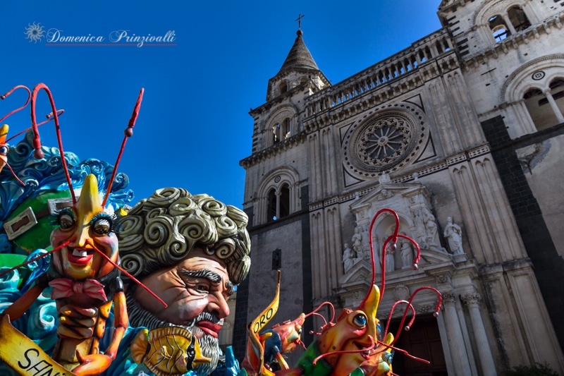Carnival floats passing through Acireale's piazza.// Where To Celebrate Carnevale in Italy With Kids.